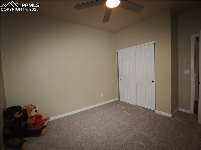 unfurnished bedroom with ceiling fan and carpet flooring