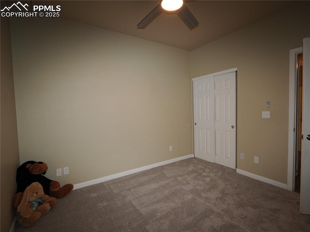 unfurnished bedroom with ceiling fan, carpet floors, and a closet