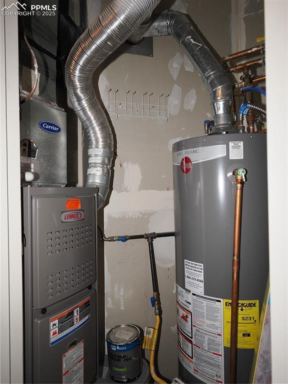 utility room featuring gas water heater