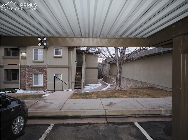 exterior space with a carport