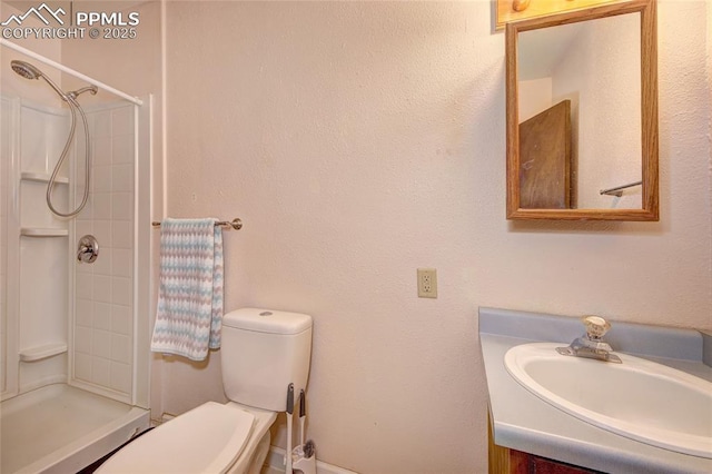 369 G St, Penrose, CO 81240 - bathroom featuring vanity, toilet, and a shower