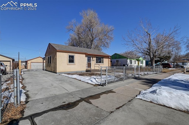 view of front of home featuring an outbuilding and a garage