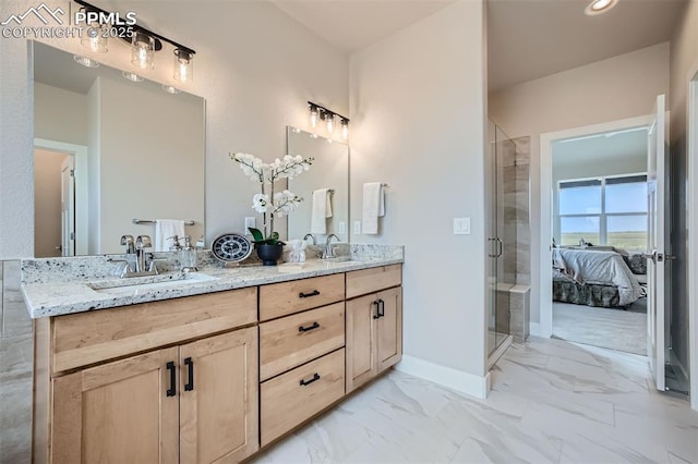 bathroom with a shower with door and vanity