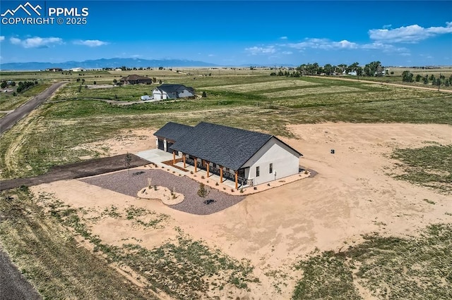 drone / aerial view with a rural view and a mountain view