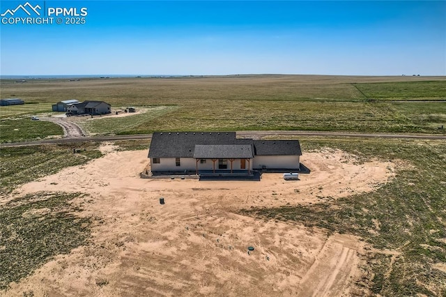 birds eye view of property featuring a rural view