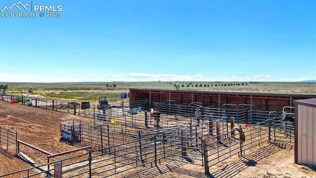 view of horse barn featuring a rural view