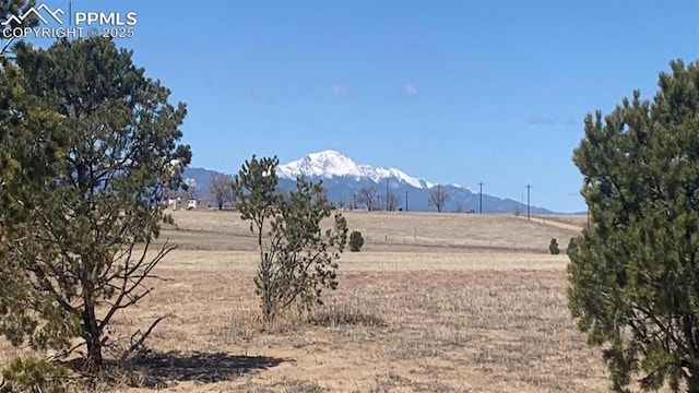 property view of mountains featuring a rural view