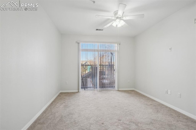 carpeted empty room featuring ceiling fan