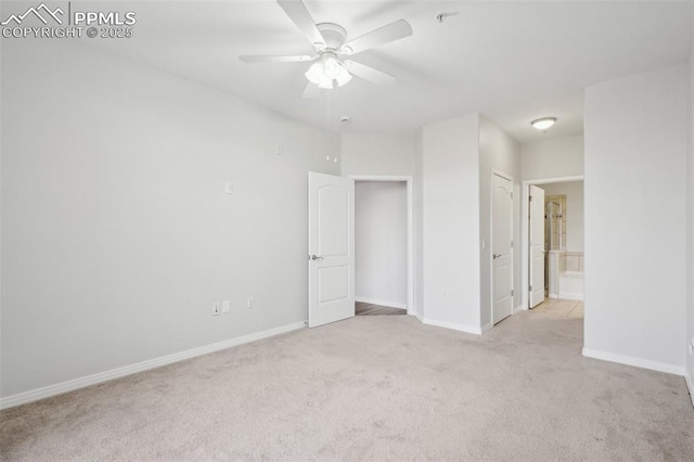 empty room with light colored carpet and ceiling fan