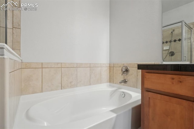 bathroom featuring vanity and plus walk in shower