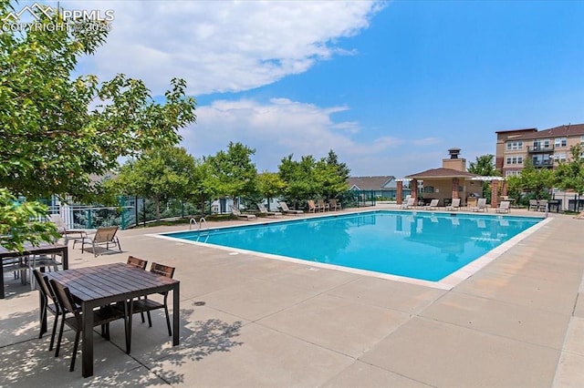 view of swimming pool featuring a patio area