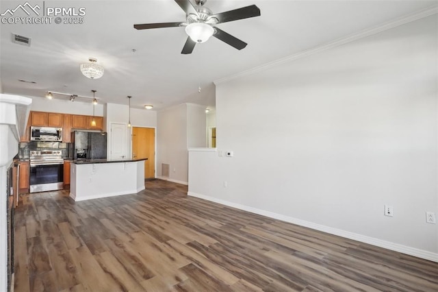 kitchen with decorative light fixtures, decorative backsplash, a center island, stainless steel appliances, and dark wood-type flooring