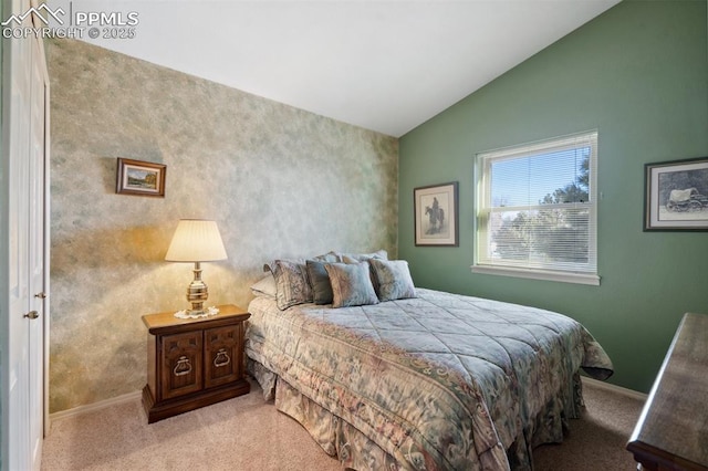 bedroom featuring light carpet and lofted ceiling