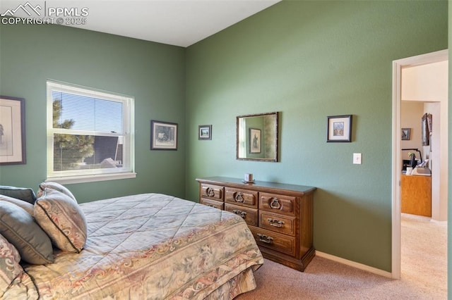 bedroom featuring light colored carpet