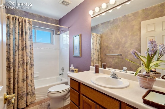 full bathroom featuring vanity, shower / tub combo, and toilet