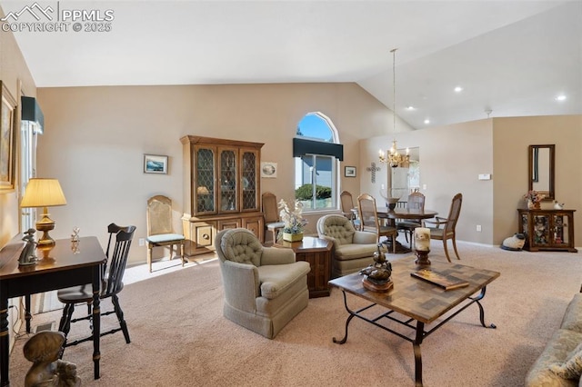 carpeted living room with high vaulted ceiling and a notable chandelier