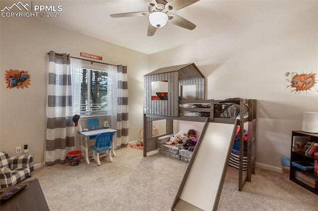 bedroom featuring ceiling fan and carpet