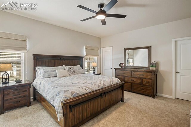 bedroom with light colored carpet and ceiling fan