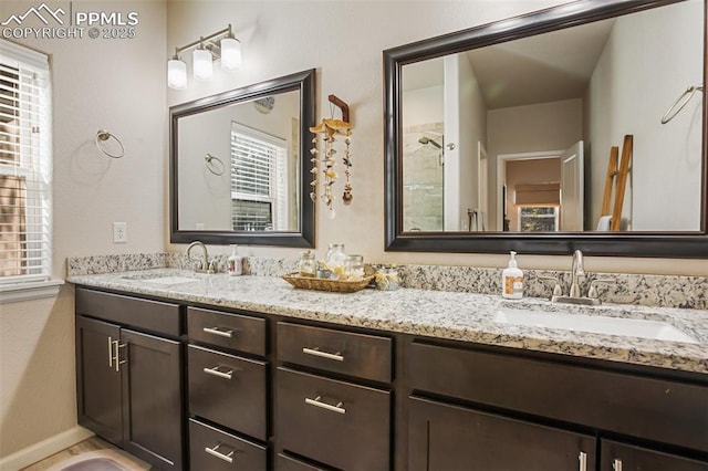 bathroom with walk in shower and vanity