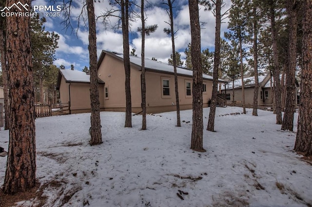 view of snow covered property