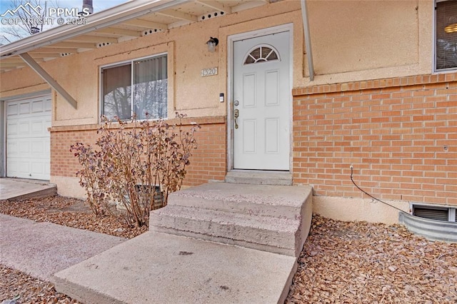 entrance to property featuring a garage