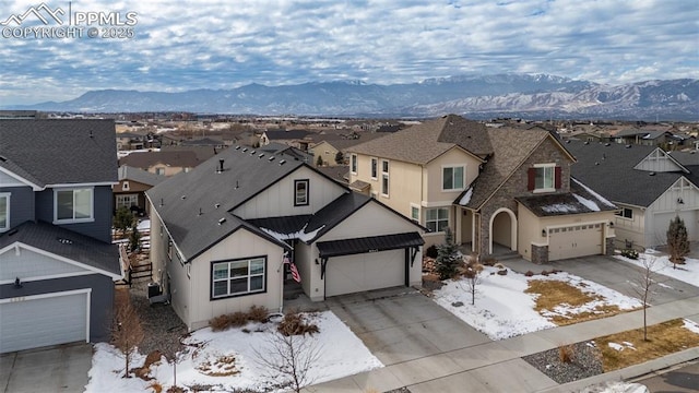 view of front of house with a garage and a mountain view