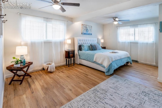 bedroom featuring wood-type flooring and ceiling fan