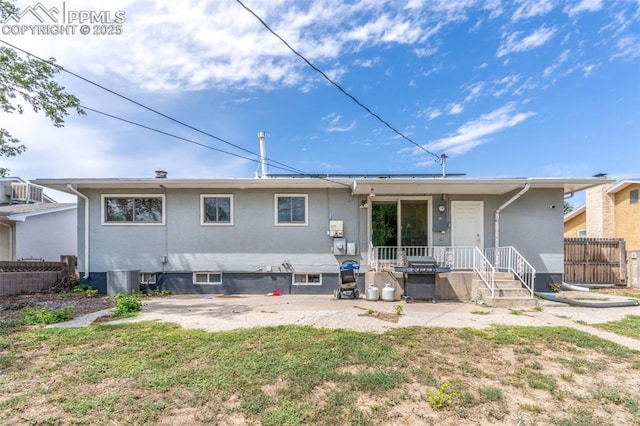 rear view of house with a yard