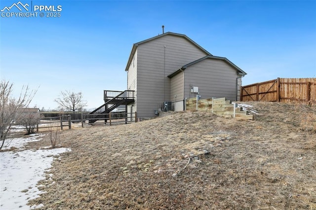 rear view of property featuring a deck