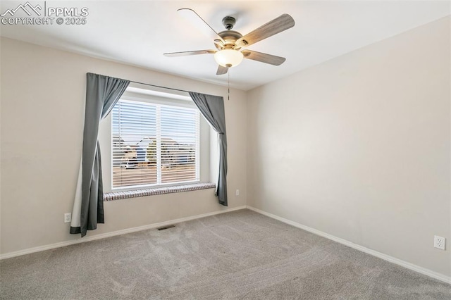 spare room with light carpet and ceiling fan