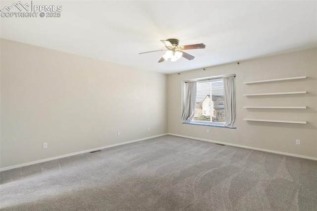 spare room with ceiling fan and carpet floors