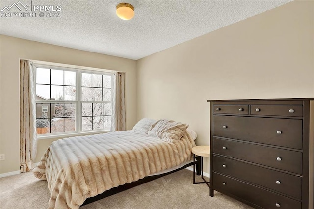 carpeted bedroom with a textured ceiling