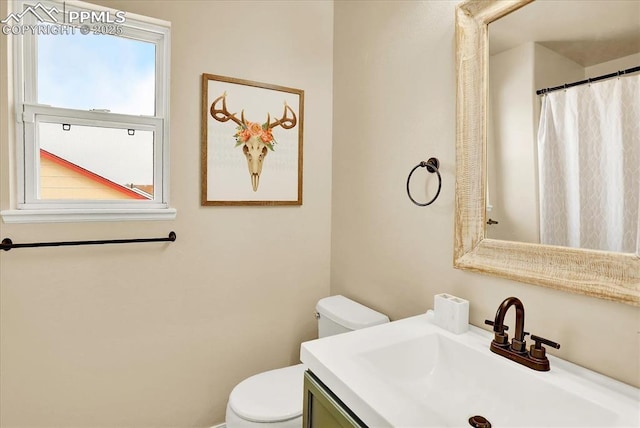 bathroom with vanity and toilet