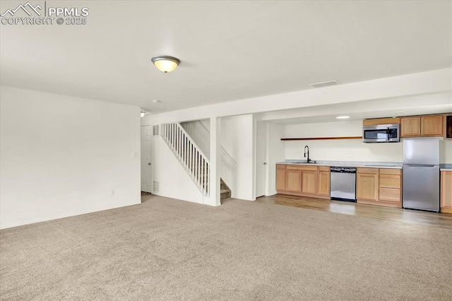 interior space featuring light colored carpet and indoor wet bar