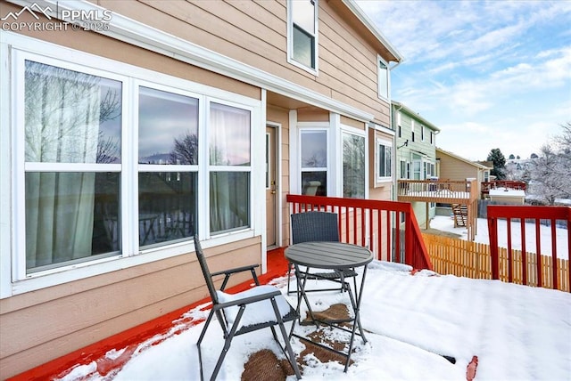 view of snow covered deck