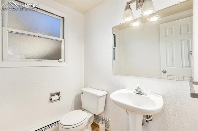 bathroom featuring toilet and sink