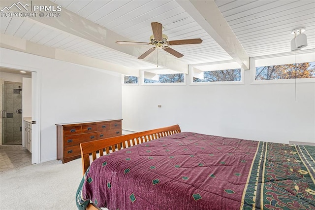 carpeted bedroom with ceiling fan, wood ceiling, ensuite bath, and beamed ceiling