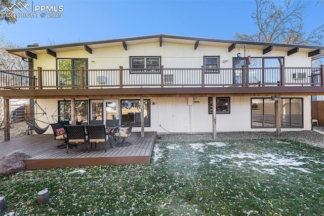 rear view of property with a deck