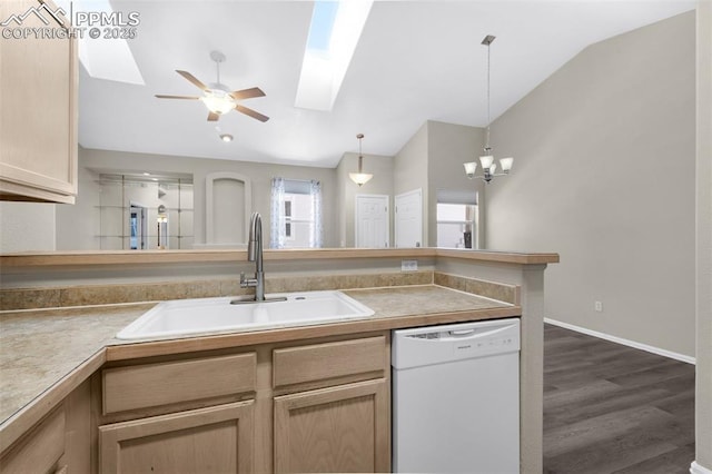 kitchen featuring lofted ceiling, light brown cabinetry, sink, white dishwasher, and ceiling fan