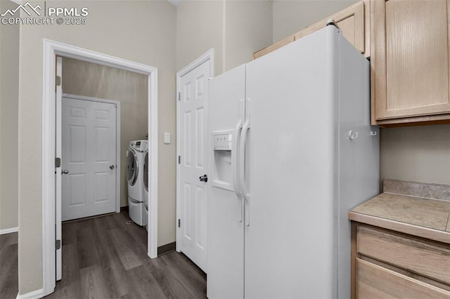 laundry area featuring dark hardwood / wood-style flooring and washing machine and dryer