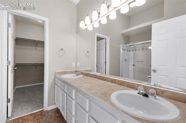 bathroom featuring vanity and a shower with shower door