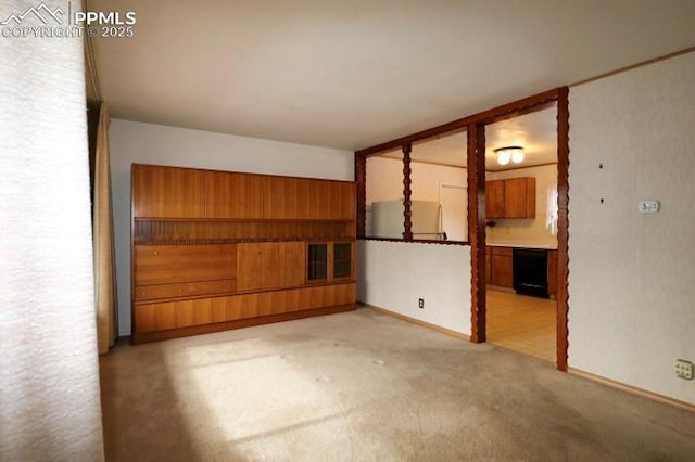 empty room featuring light colored carpet