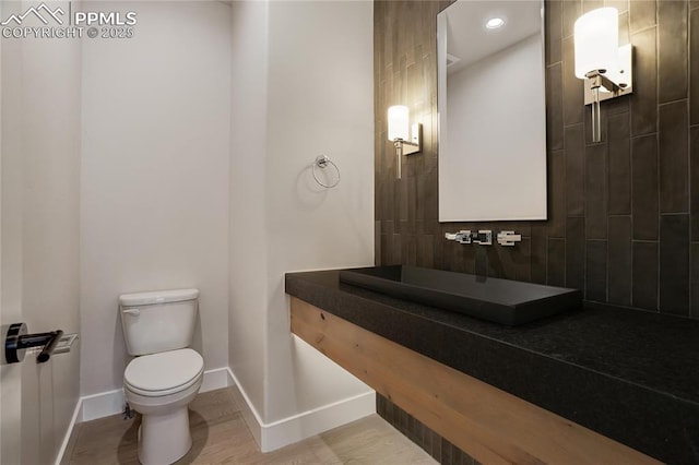 bathroom featuring sink and toilet