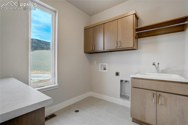 laundry room with sink, cabinets, hookup for a washing machine, a mountain view, and hookup for an electric dryer