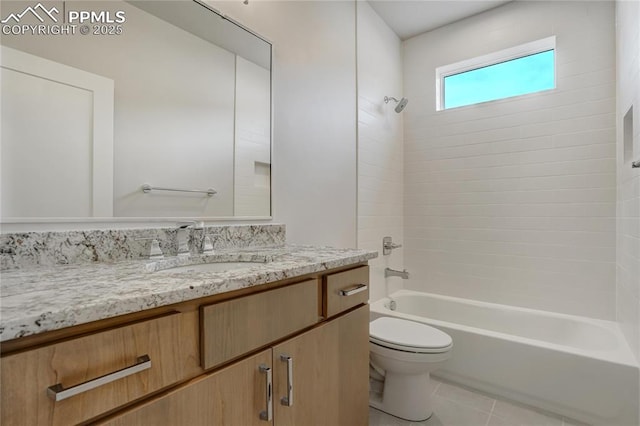 full bathroom featuring vanity, toilet, tiled shower / bath combo, and tile patterned flooring