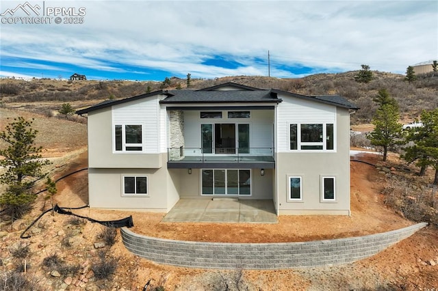 back of house featuring a patio area