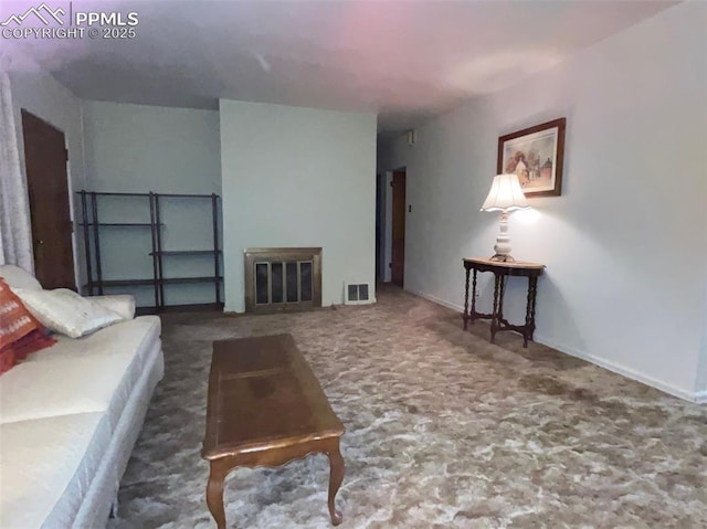 living room with dark colored carpet