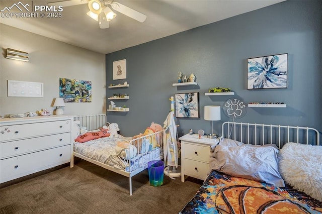 bedroom featuring ceiling fan and dark carpet