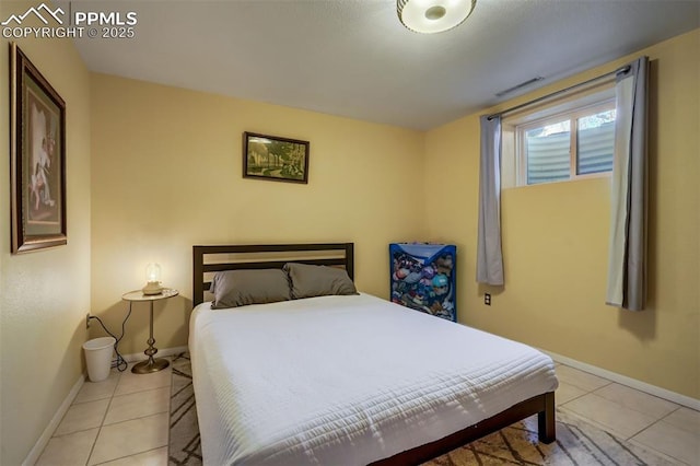 bedroom with light tile patterned flooring