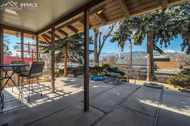 view of patio / terrace featuring a mountain view